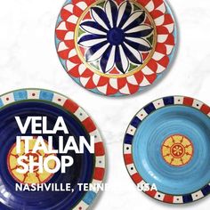 three plates with different designs on them and the words vela italian shop above it