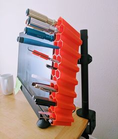 a stack of knives sitting on top of a wooden table