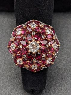 "Genuine Orissa Rhodolite Garnet and White Zircon Statement / Cocktail Ring in 14K Rose Gold over Sterling Silver (size 5) (avg 8g) (15.07 ctw). Stunning and spectacular (delightfully gaudy) field of wine-red Rhodolite Garnet \"flowers\" speckled with icy White Zircon, set in a Rose Gold blush which beautifully compliments the deep red of the Garnet. Orissa Rhodolite Garnet is a lush, rosy Bordeaux red gem created from a rare naturally occurring mixture of pyrope and almandine garnet.  Most peop Almandine Garnet, The Color Red, Stylish Rings, Rhodolite Garnet, Gorgeous Necklaces, Cocktail Ring, Cocktail Rings, A Rose, Wine Red