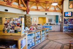 the inside of a store with lots of items on display and shelves full of goods