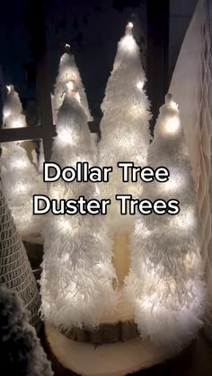 three white christmas trees with lights on them and the words dollar tree duster trees