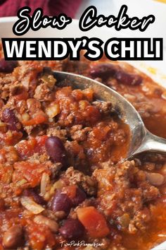 slow cooker wendy's chili recipe in a white bowl with the title above it