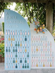 an outdoor display with bottles and flowers on it