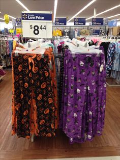 two women's halloween pants are on display in the store for $ 8 each