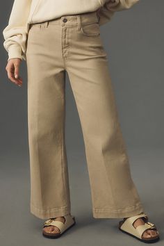 98% cotton, 2% elastane Five-pocket styling Front zip Machine wash Imported | The Anessa High-Rise Crop Wide-Leg Jeans by PAIGE in Beige, Women's, Size: 24, Cotton/Elastane at Anthropologie Neutral Cotton Bottoms With Five Pockets, Beige Relaxed Fit Jeans With Patch Pockets, Beige Jeans With Patch Pockets For Work, Mid-rise Cotton Bottoms For Work, Neutral Wide Leg Cotton Jeans, Neutral Cotton Bottoms With Side Pockets, Neutral Cotton Pants With Straight Hem, Neutral Cotton Wide Leg Jeans, Spring Khaki Jeans For Workwear