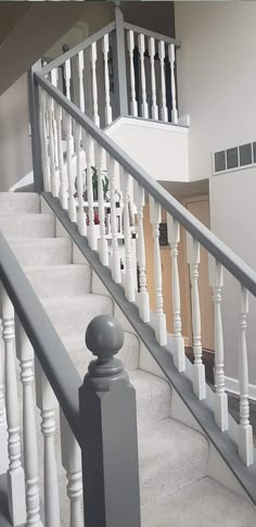 there is a white stair case on the stairs