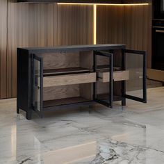 a kitchen with marble counter tops and wooden cabinetry in the center, along with an oven