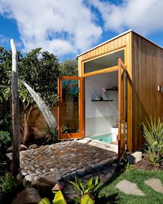 a small house with a pool in the backyard