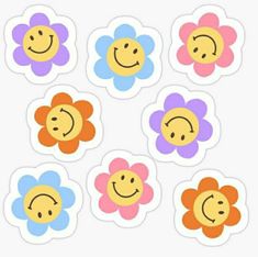 six flower stickers with smiley faces on them