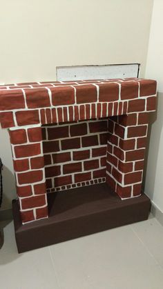 a red brick fireplace in a white room