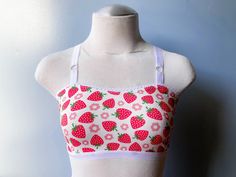 Strawberries on pale pink background Soft and stretchy cotton knit Fabric white elastic trim 🤍NOTE: Delicate Wash; HAND WASH recommended & hang dry.🤍 ✨Fiber content: Cotton spandex ✨Stainless Steel metal hardware 🦋photo is Basic Bralette Style🦋 *Reverie Intimates is size inclusive, please reach out if you want/need a size not listed in the options. IF PURCHASING A CUSTOM SIZE PLEASE ALLOW 3-5 EXTRA DAYS FOR ME TO GATHER YOUR MEASUREMENTS AND CREATE YOUR CUSTOM PIECE.* Knit Bralette, Steel Metal, Metal Hardware, Cotton Knit, Pink Background, Pale Pink, Cotton Spandex, Strawberries, Bralette