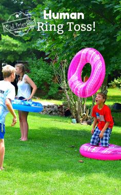 children playing with inflatable toys on the lawn