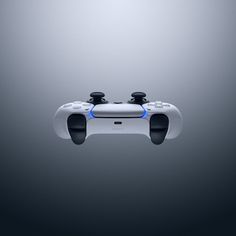 a video game controller flying through the air with two controllers attached to it's sides