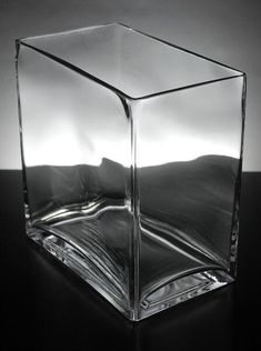 a glass cube sitting on top of a table