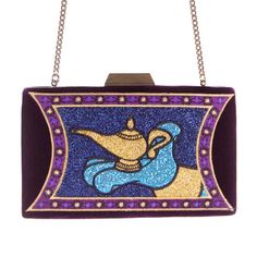 a purple purse with an image of a woman holding a baby elephant on it's back