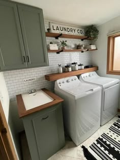 this is an image of a laundry room with washer and dryer