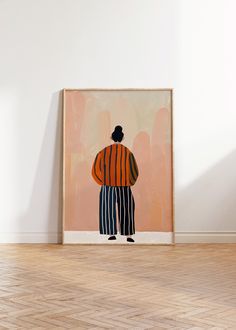 a painting on the wall in an empty room with wood flooring and white walls