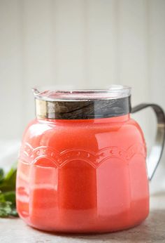 a glass jar filled with liquid sitting on top of a counter