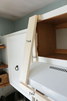 measurements for the upper half of a kitchen cabinet