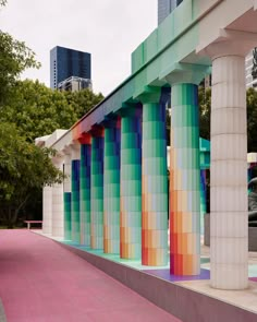 colorful columns are lined up along the sidewalk