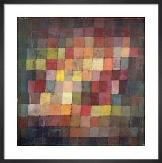 an abstract painting with squares and colors in black frame on the wall by corbi