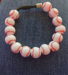 Baseball fan? This bracelet is for you!⚾ Mini baseball beads on a 7.5 inch stretchable non-latex "silky smooth"  rubber cord.  🐾 How To Make Baseball Bracelets, Baseball Bracelets For Men, Baseball Bead Bracelet, Diy Baseball Jewelry, Baseball Jewelry, Baseball Bracelet, Baseball Fan, Live Lokai Bracelet, Jewelry Bracelets