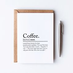 a note card with the words coffee written on it and a pen next to it