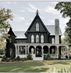 a large black and white house with lots of windows