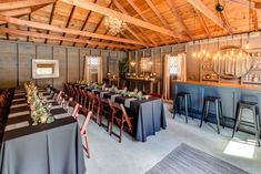 a large room with tables and chairs set up for a formal function in the center