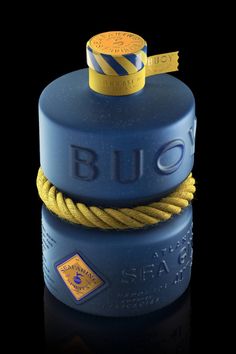 a blue bottle with a yellow rope around it's neck and the word bud on top