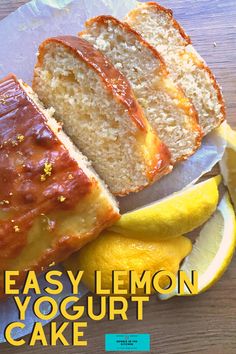 a loaf of lemon yogurt cake next to sliced lemons