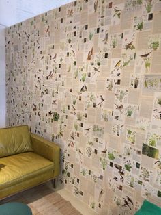 a living room with a couch and wall paper