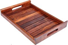 a wooden tray with handles is shown on a white background