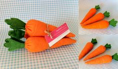 three carrots are sitting on a table with a tag in the middle of them