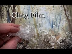 a person holding something in their hand with the words cling film over it and trees