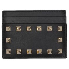 Black leather card holder by Valentino. Gold-tone Rockstud embellishments at side. Multiple card slots. 3.25" height, 0.5" width, 4.25" length. Valentino Rockstud, Elizabeth Taylor, Small Accessories, Card Holder Leather, Fashion Handbags, Valentino Garavani, Purse Wallet, Christian Dior, Balenciaga