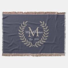 a personalized throw blanket with a laurel design