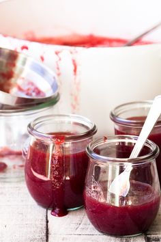 three jars filled with different types of liquid