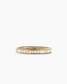 a yellow gold band with baguettes and diamonds