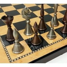 a chess board with metal pieces on it