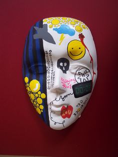 a white mask with colorful images on it