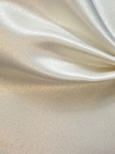 the white fabric is very soft and shiny