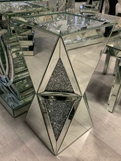 a mirrored table with several mirrors on it