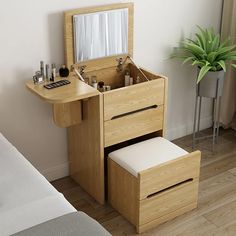 a wooden vanity with drawers and a mirror on the wall next to a plant in a bedroom