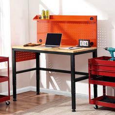 a workbench with a laptop and tools on it