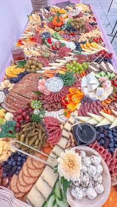 a long table covered in lots of different types of food