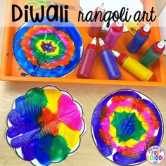 colorful paper plates and crayon markers on a tray with the words diwali rangoli art