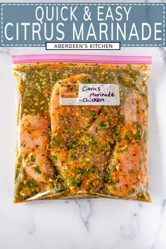 a bag of salmon fillets on top of a marble counter with a pink ribbon