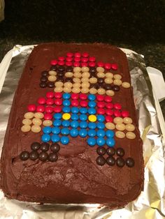 a cake decorated with chocolate and colored candies