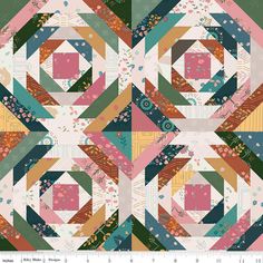 a quilt pattern with different colors and shapes